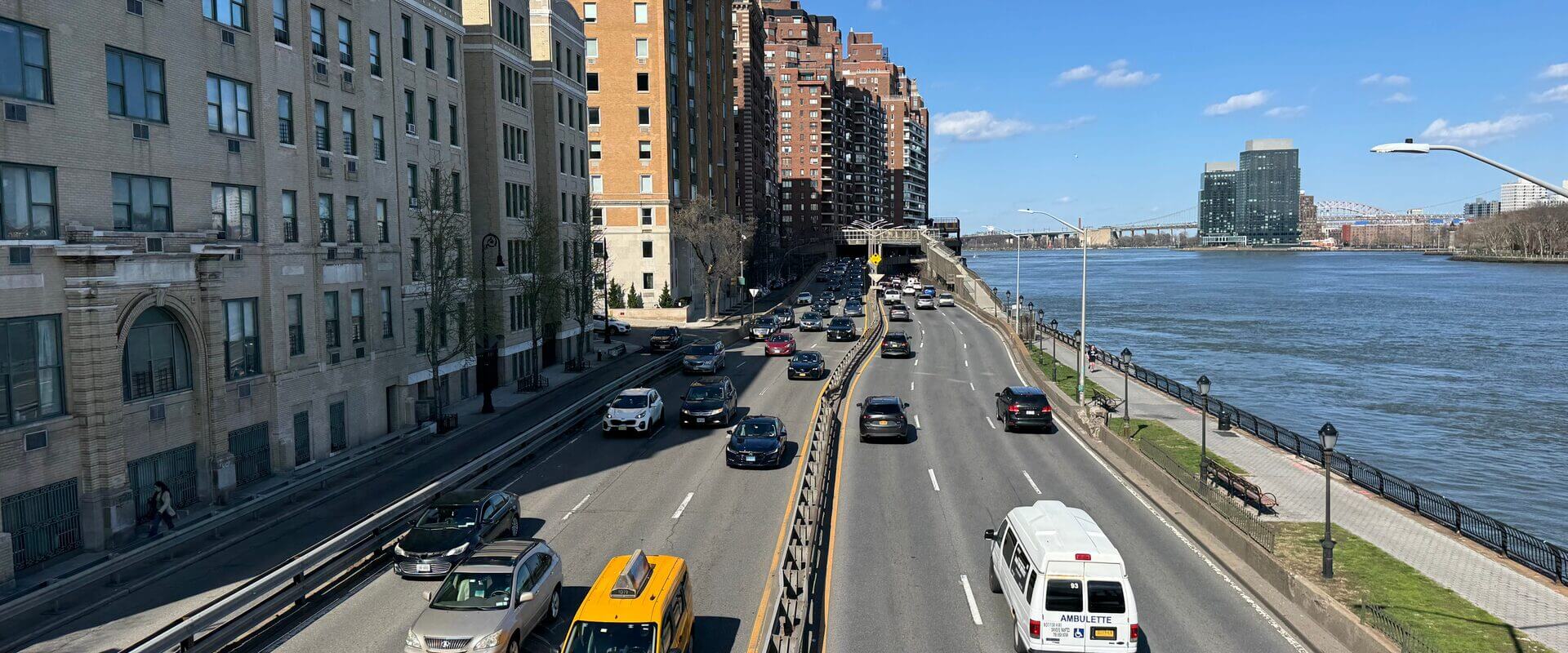 FDR Drive along the East River with Upper East Side apartment buildings and the Queensboro Bridge